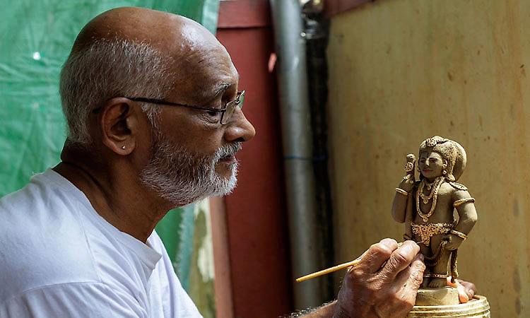Clay idol of Lord Krishna takes shape in artist Somanath’s hands