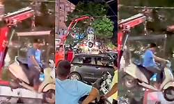 Viral Video: ಕ್ರೇನ್ ಮೂಲಕ ಸ್ಕೂಟರ್ ಮೇಲಕ್ಕೆತ್ತಿದರೂ ಅದರ ಮೇಲೆಯೇ ಕುಳಿತ ಮಾಲೀಕ!
