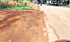 Rainwater flows on State Highway during monsoon
