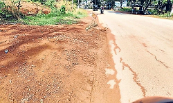 Rainwater flows on State Highway during monsoon