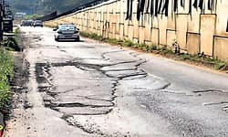 Ambalpady service road riddled with potholes; residents demand immediate repair