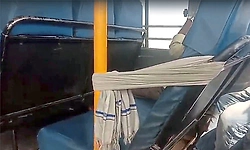 Farmer ties towel to broken seat in government bus, highlights poor condition