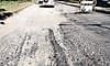 Pothole-ridden Gundibail road troubles motorists and pedestrians