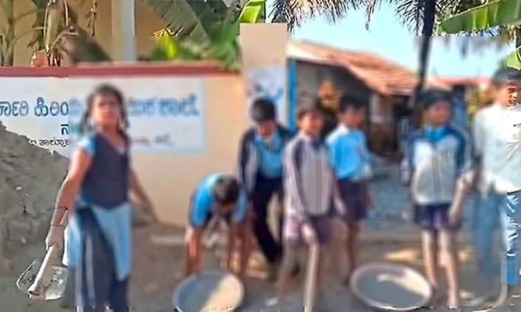 Teachers make students do labour work for school road in Mandya village