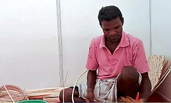 Basket weaver from Karkala draws attention at ‘Namma Sante’ in Manipal