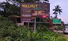 ಅತ್ತಿಗೆರೆ: ಬಸ್ ತಂಗುದಾಣದ ಬಳಿ ನಿಯಮಬಾಹಿರವಾಗಿ ಹಾಕಲಾದ ಜಾಹೀರಾತು ಬೋರ್ಡ್ ತೆರವಿಗೆ ಆಗ್ರಹ