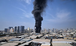 In war-torn Iran, air pollution from burning oil depots & bombed buildings unleashes invisible health threats