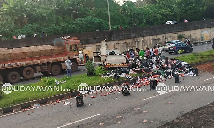 Tyre bursts, pickup vehicle carrying pomegranates overturns in Udupi
