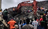 Landslide at landfill in capital of Guinea kills 30 people, officials say