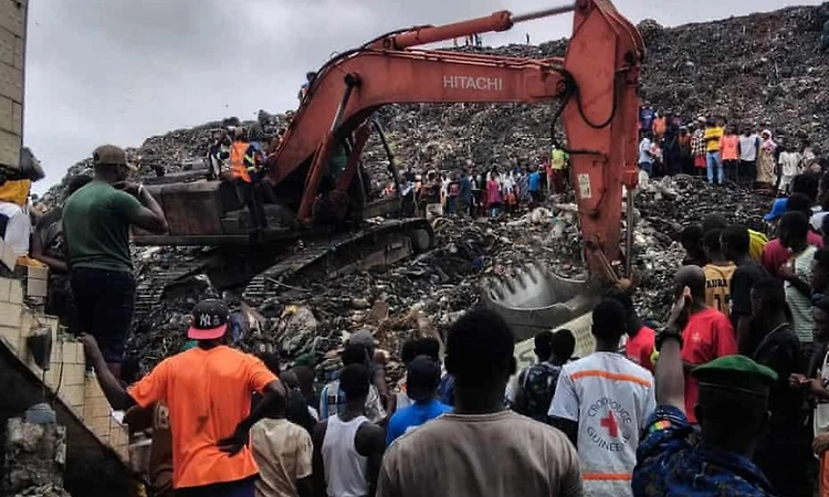 Landslide at landfill in capital of Guinea kills 30 people, officials say