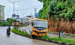 Manipal: School bus jumps onto divider on downhill stretch!