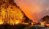 Wildfires in France drive 250,000 people from their homes, creep toward wine city