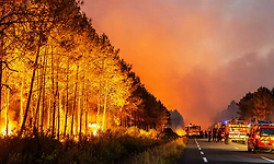 Wildfires in France drive 250,000 people from their homes, creep toward wine city