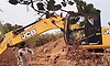 Female officer takes bold stand against illegal mining, throws stone at JCB in Belagavi