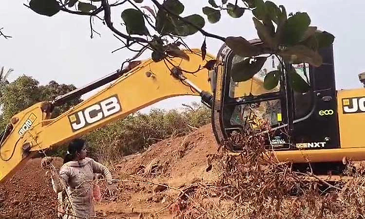Female officer takes bold stand against illegal mining, throws stone at JCB in Belagavi
