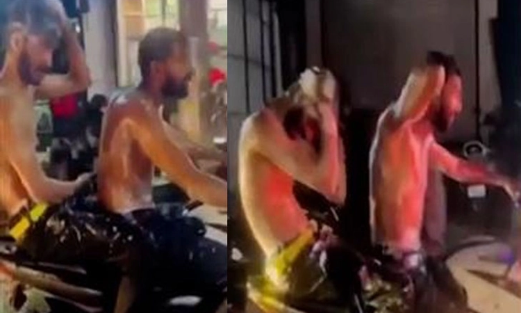 ಬೈಕ್ ನಲ್ಲಿ ತೆರಳುತ್ತಿದ್ದ ವೇಳೆ ಸ್ನಾನ ; ವಿಡಿಯೋ ವೈರಲ್ ; ಇಬ್ಬರು ಅರೆಸ್ಟ್