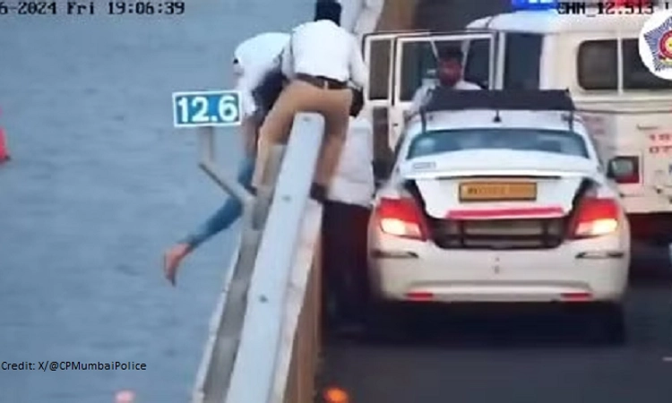 Woman loses balance while sitting on Atal Setu safety barrier, saved by alert cop