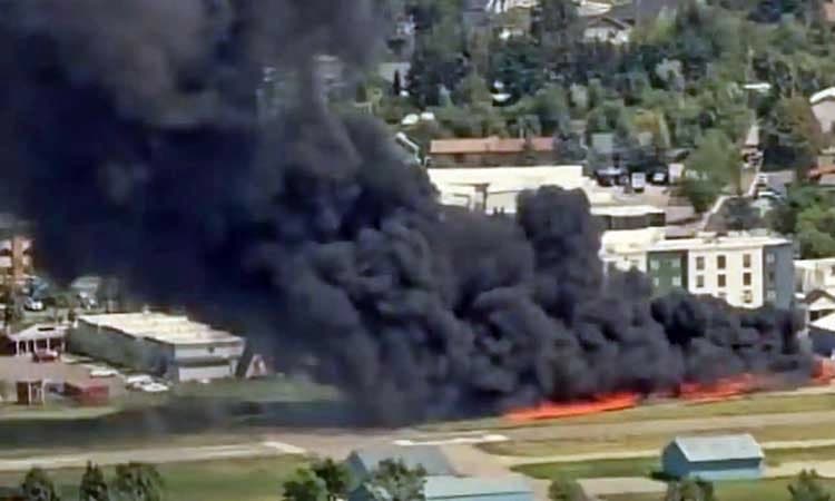 Plane crashes into parked aircraft while landing at Montana airport, sparking fire