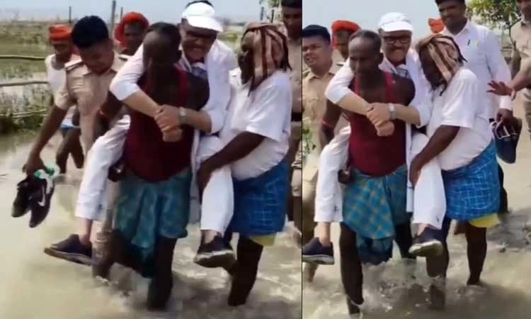 Video: MP inspects flood while sitting on villagers’ shoulders in flood-hit area