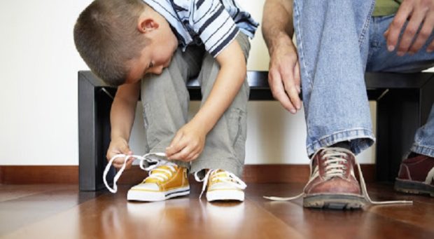 Little Boy Lacing his Shoes — Image by © Royalty-Free/Corbis