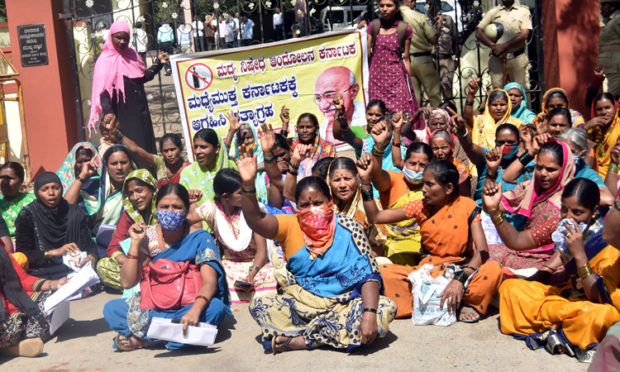 Women protest calling for a ban on alcohol